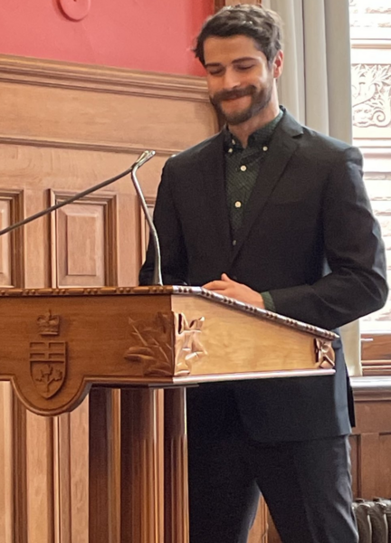 Kevin speaking at the podium